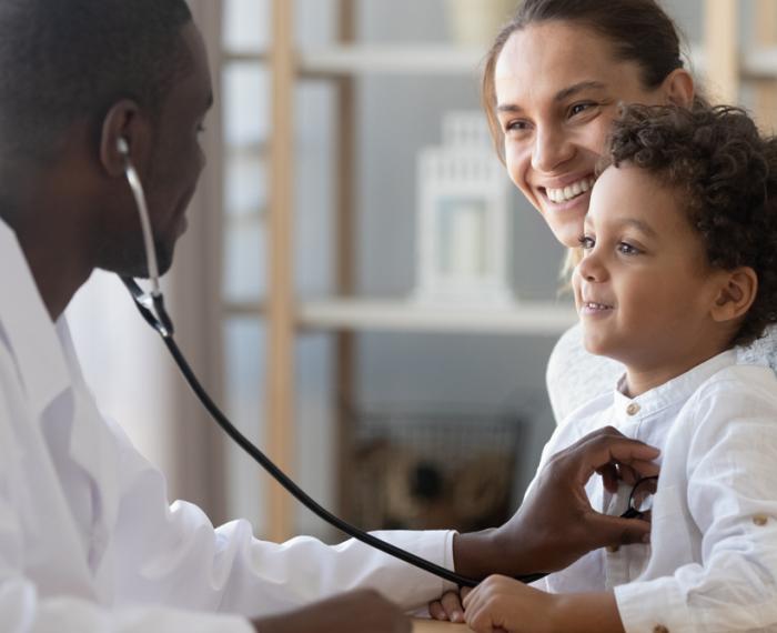 doctor with mother and baby